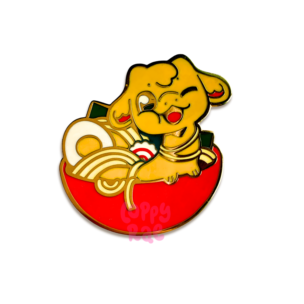 Enamel pin featuring dragon in cup of noodles.
