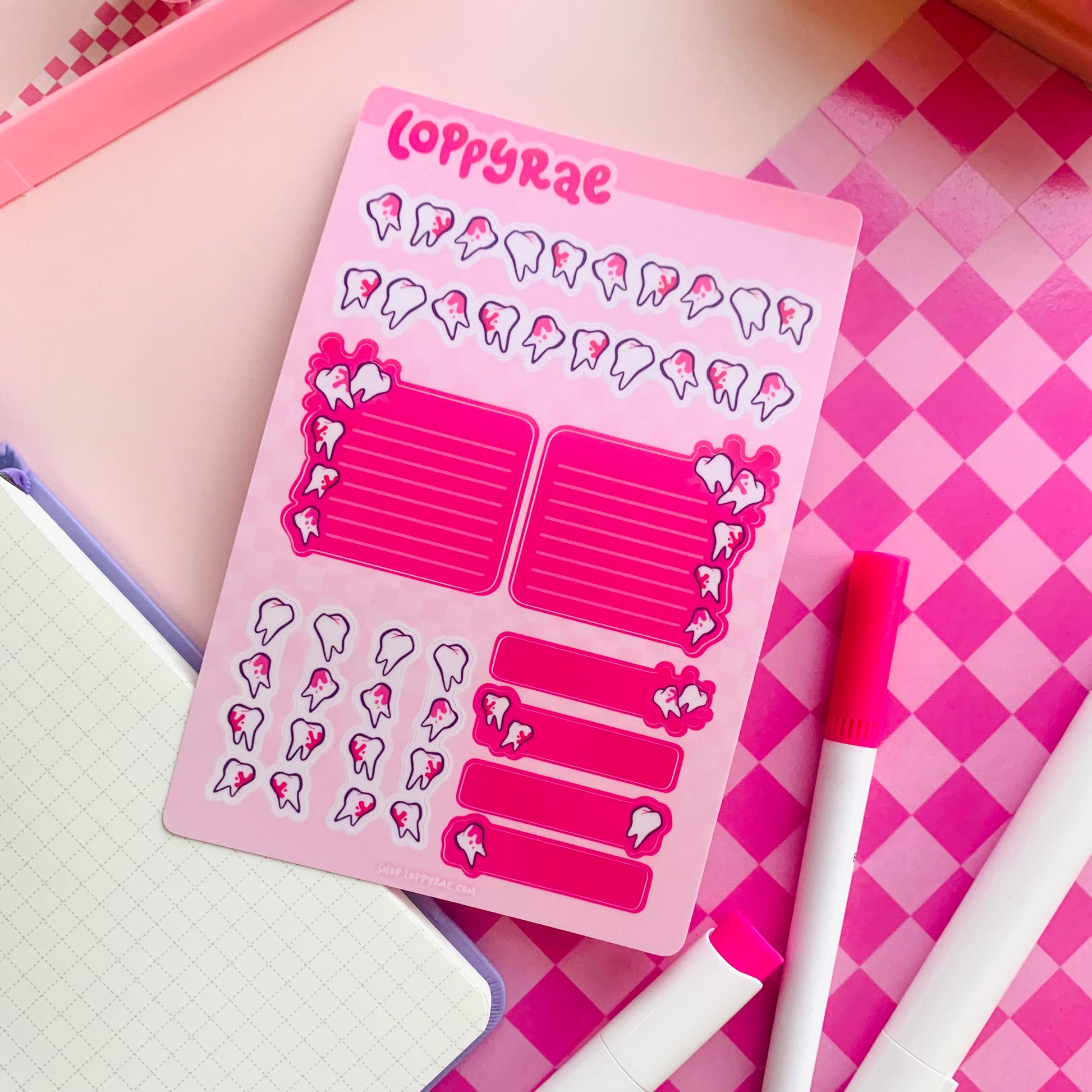 Pink planner sticker sheet with tooth motifs on a pink checkered background.